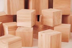 Stack wooden blocks from natural wood on a white background. Copy, empty space for text photo