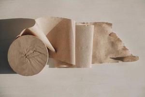 Paper roll on the table. Top view. Copy, empty space for text photo