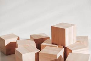 Wooden cubes from natural wood on a white background. Copy, empty space for text photo