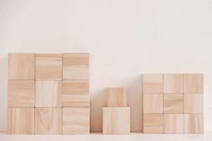 Wooden cubes from natural wood on a white background. Copy, empty space for text photo