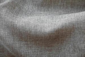 Crumpled gray linen fabric as background texture. Top view. Copy, empty space for text photo