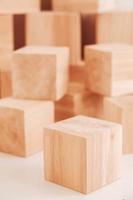 Stack wooden blocks from natural wood on a white background. Copy, empty space for text photo