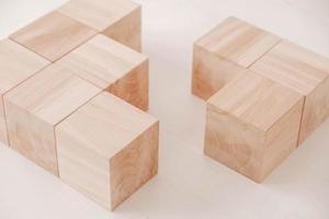 Stack wooden blocks from natural wood on a white background. Copy, empty space for text photo