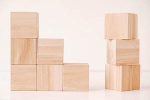 Stack wooden blocks from natural wood on a white background. Copy, empty space for text photo