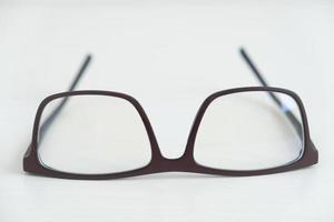 Optical glasses in a dark frame on a white background. Copy, empty space for text photo