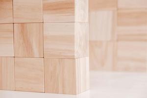 Wooden cubes from natural wood on a white background. Copy, empty space for text photo