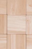 Texture of wooden cubes from natural wood as a background. Copy, empty space for text photo