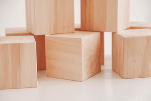 Stack wooden blocks from natural wood on a white background. Copy, empty space for text photo