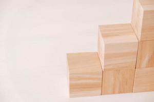 Stack wooden blocks from natural wood on a white background. Copy, empty space for text photo