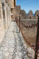 Frias castle tour with iron railings. Stone building with batlements. Frias, Burgos, Merindades, Spain photo