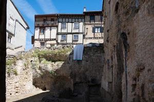 Traditional architecture at Frias, Merindades. Ancient houses with wood details. No people, Burgos, Spain photo