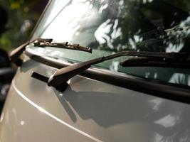 the front of the city car. modern minimalist car illuminated by the sun photo