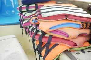 stack of life jacket in a boat photo