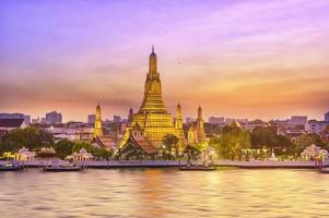 Beautiful view of Wat Arun Temple at sunset in Bangkok, Thailand photo