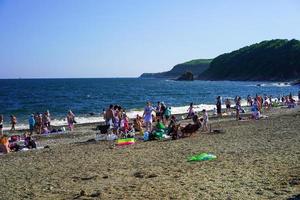 Vladivostok, Russia-July 17, 2020-Seascape with people in Glass Bay. photo