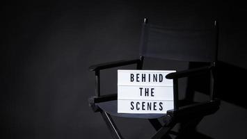 Director chair with behind the scene banner light box. photo