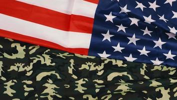 American flag and Military camouflage pattern. Top view angle. photo