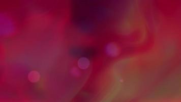Red and yellow gradient neon color with sparkles. Moving abstract blurred background. video