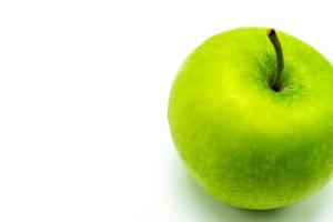 Delicious green apple, on a white background photo