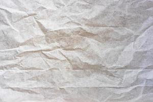 White crumpled paper background, the texture is old for a web design screensaver. Template for various purposes photo