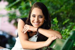 Happy young woman with blue eyes looking at camera. photo