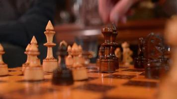 Chess Boards And Chess Pieces Game - close-up two Men playing video