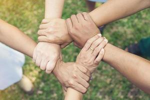 Ring of hands teamwork showing top view photo