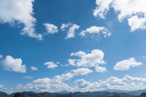 blue sky background with white cumulus clouds the day photo