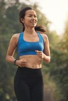 beauty woman smiling running in outdoor park photo