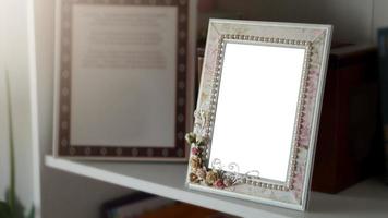 Mockup of a picture frame on a shelf with white space photo