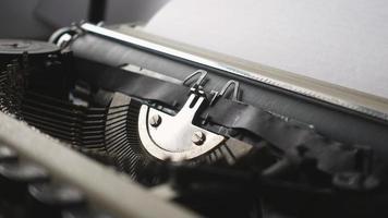 An author working on an old retro mechanical typewriter photo