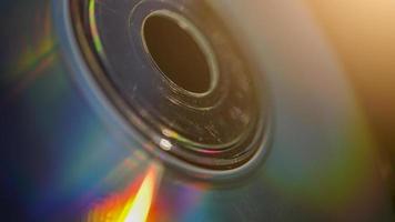 Macro shot of and old compact CD disk with sun rays photo