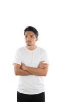 Young handsome man with t-shirt standing arms crossed on isolated white background . photo
