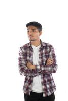 Portrait of a young hipster man standing isolated on a white background photo