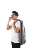 Young Business hipster man smoking a cigarette isolated on white background. photo