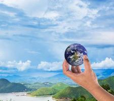 holding a glowing earth globe, element global by nasa photo