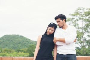 Portrait of an attractive woman seriously listening to her boyfriend while on a date,spend good time together. photo