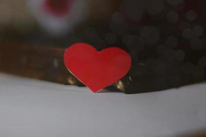 Happy Valentines day, paper hearts on wooden background with lights background photo