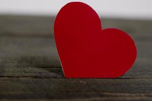 Happy Valentines day, paper hearts on wooden background with lights background photo