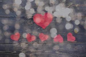 Happy Valentines day, paper hearts on wooden background with lights background photo