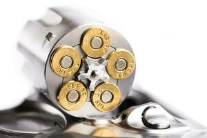 Macro shot of an open revolver loaded with bullets photo