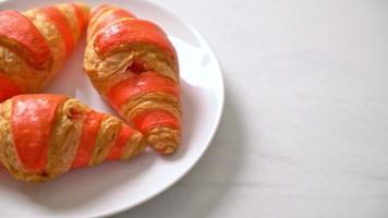 fresh croissant with strawberry jam sauce on plate video