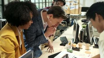 Multiracial coworkers' team and colleagues brainstormed, discussing marketing strategy, ideas collaboration, and business project planning at an office's conference table in staff meeting workplace. video