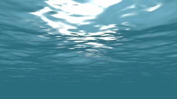 Underwater light filters down through blue ocean waves video