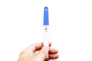 Woman is holding positive pregnancy test in her hand. Close-up. Isolated on white background.With clipping path. photo