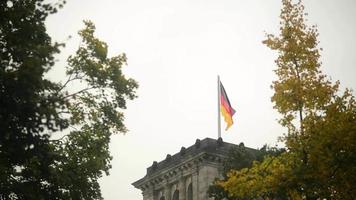 Flag of Germany on the Reichstag building - cloudy Day