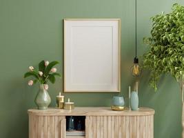 Mock up photo frame green wall mounted on the wooden cabinet with beautiful plants.