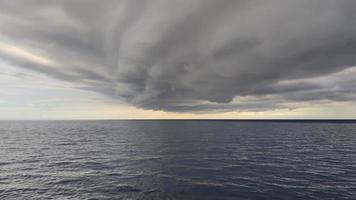 Cumulonimbus is a dense, towering vertical cloud,forming from water vapor carried by powerful upward air currents. If observed during a storm, these clouds may be referred to as thunderheads. photo