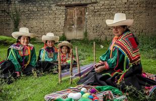 Peruvian andean womans posing in diferents actions photo