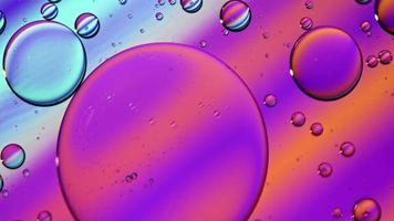 Abstract Colorful Food Oil Drops Bubbles and spheres Flowing on Water Surface, macro Videography video